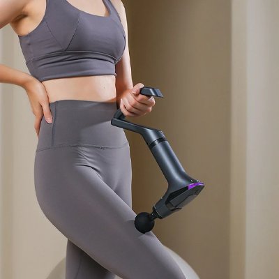 Pistolet de massage sur la jambe poingnee longue 